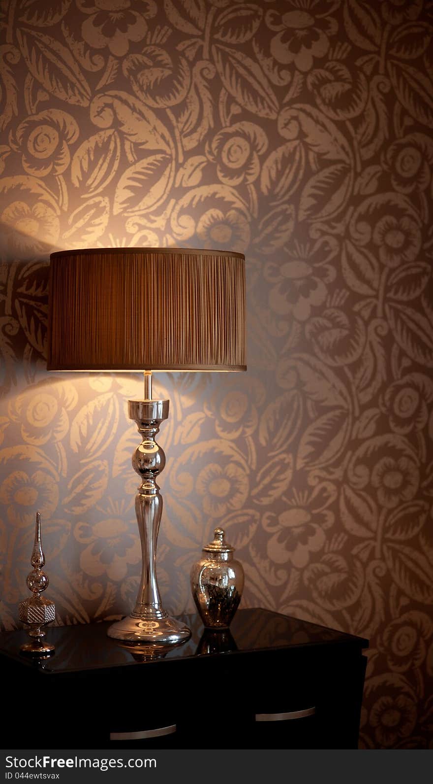 A table lamp on a beside table