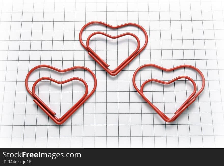 Closeup of heart shaped red paper clips. Closeup of heart shaped red paper clips