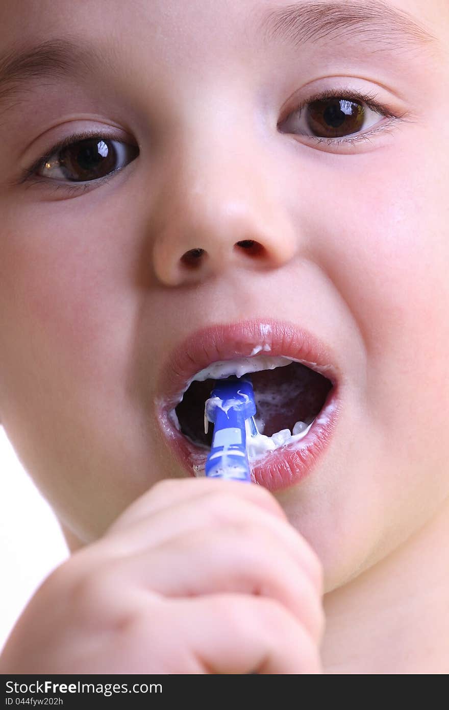 Beautiful little boy to brush his teeth,blue brush