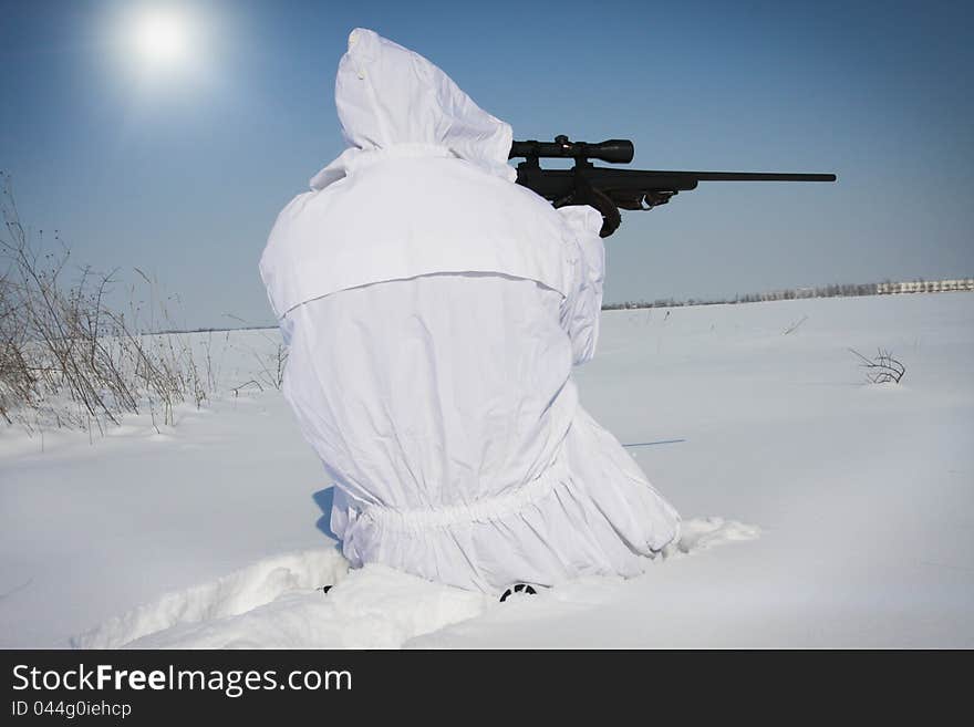 Man preparing to take a long shot during a winter blizzard. Man preparing to take a long shot during a winter blizzard