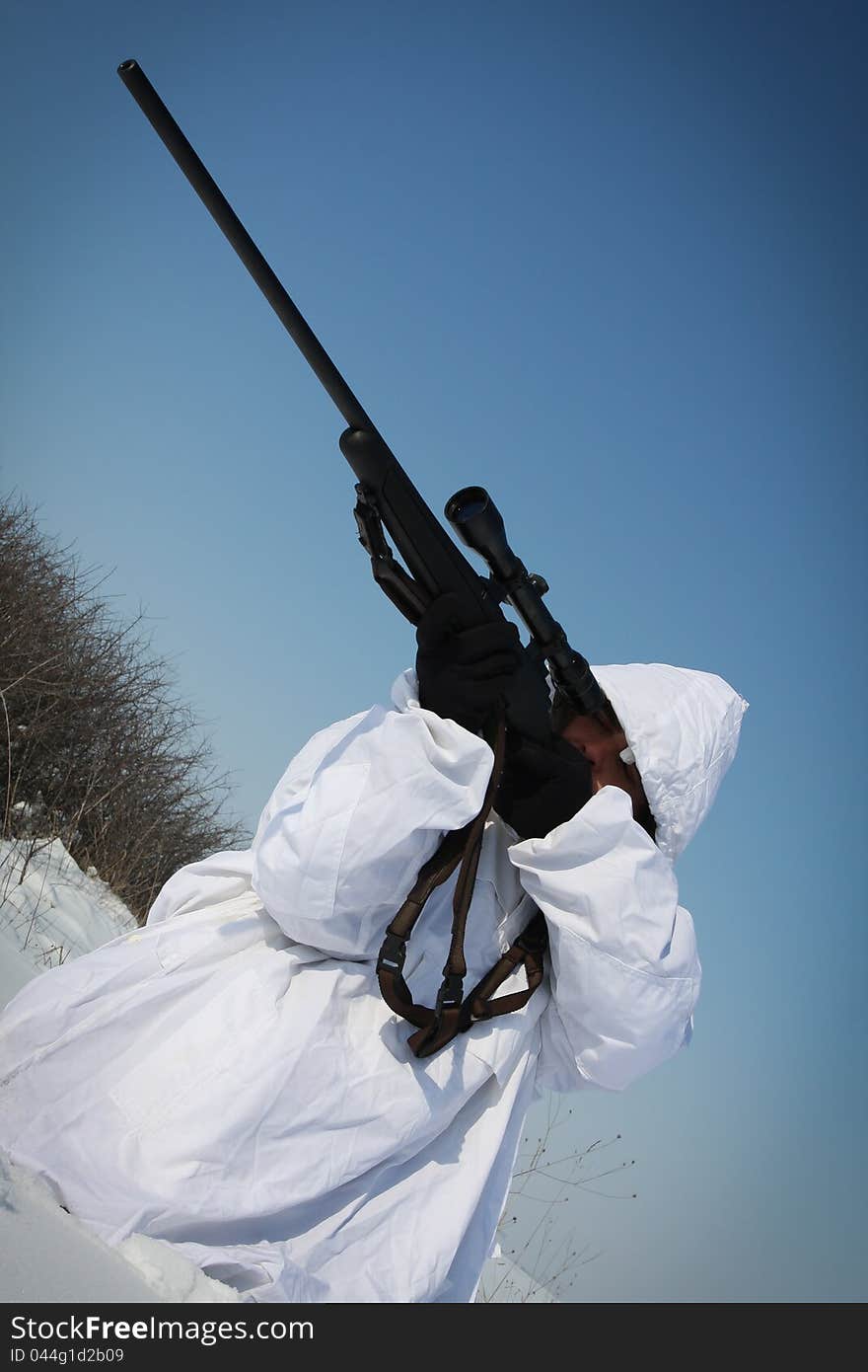 Man preparing to take a long shot during a winter blizzard. Man preparing to take a long shot during a winter blizzard