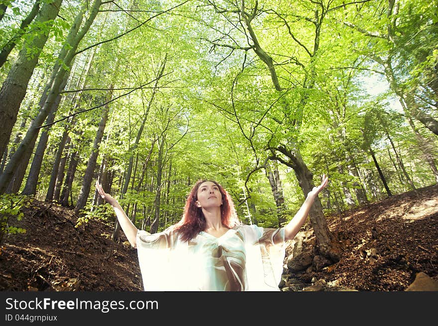 Forest girl in front of trees