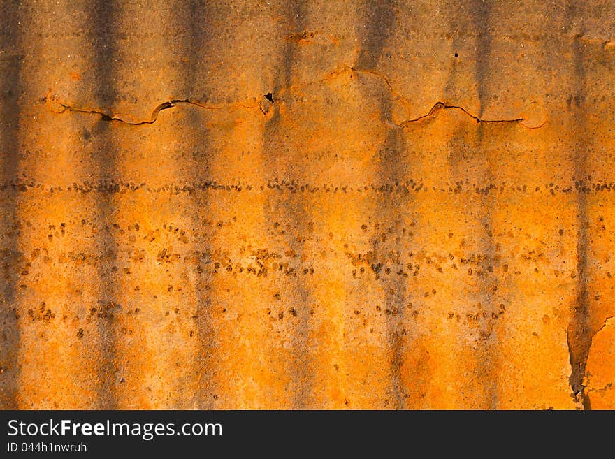 Zinc roof surface is broken and rusty yellow. Zinc roof surface is broken and rusty yellow.