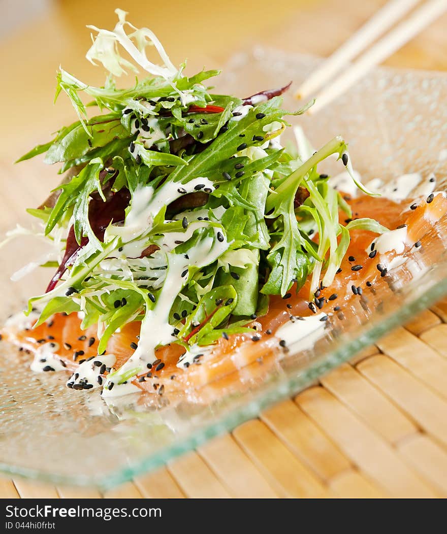 Smoked Salmon Salad on glass plate