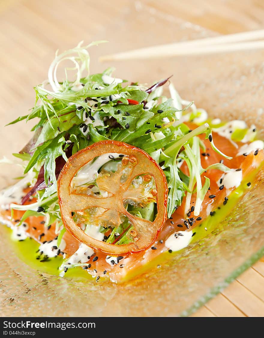 Smoked Salmon Salad on glass plate