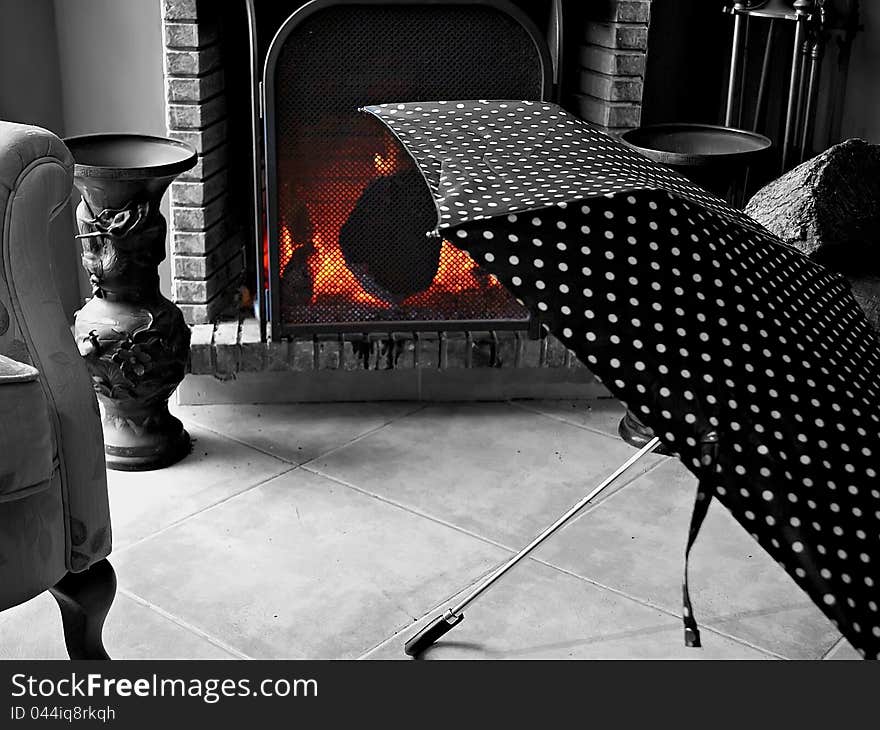 Umbrella drying in the fireplace