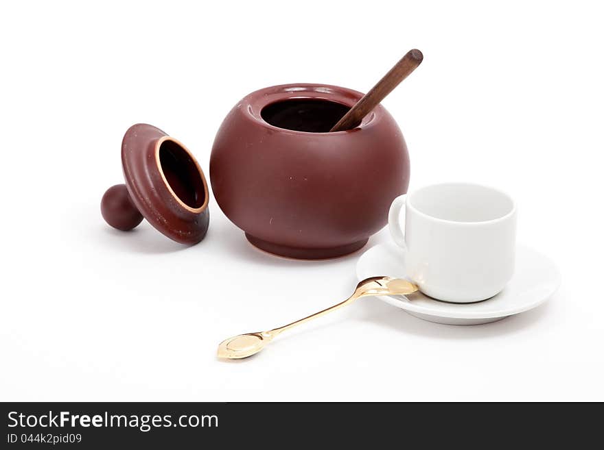 Sugar pot with white cup and spoon