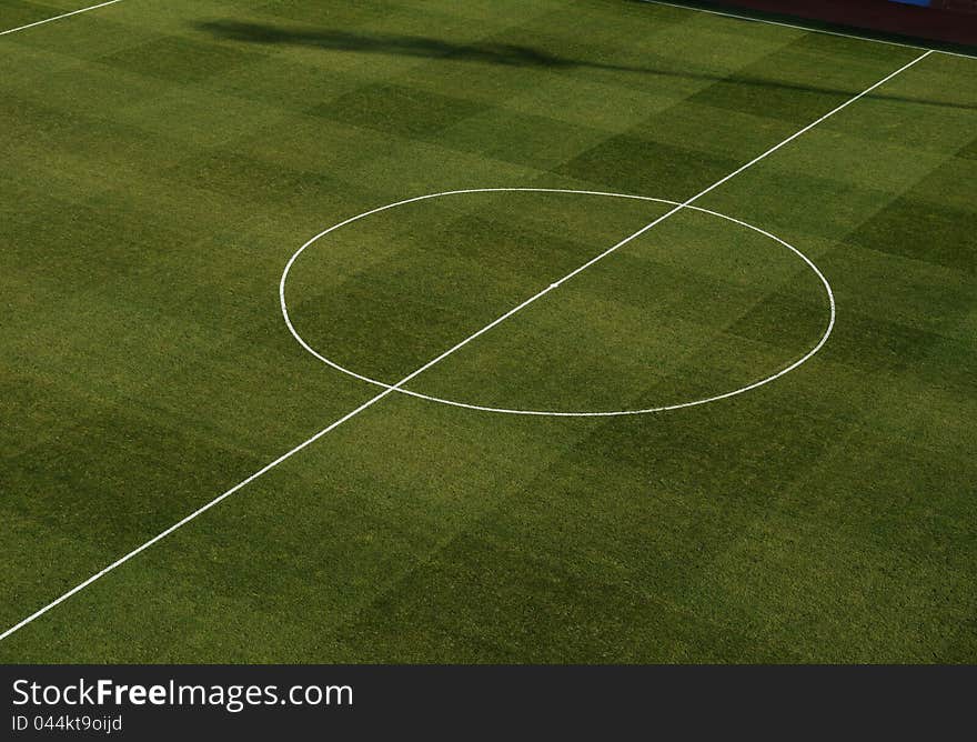 Center of a football field sports, green lawn, marking. Center of a football field sports, green lawn, marking