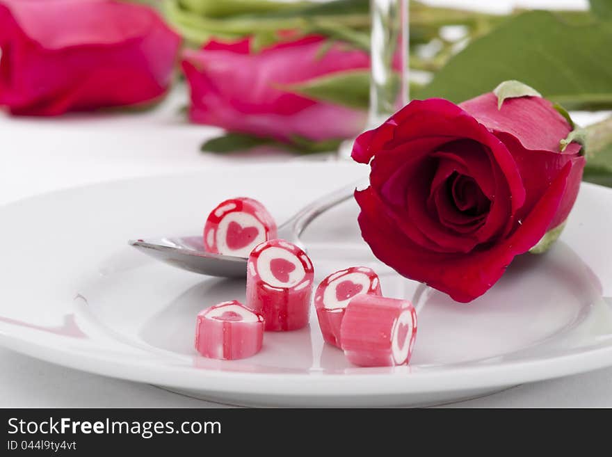 Valentine Series, Candy on dish with rose on white background