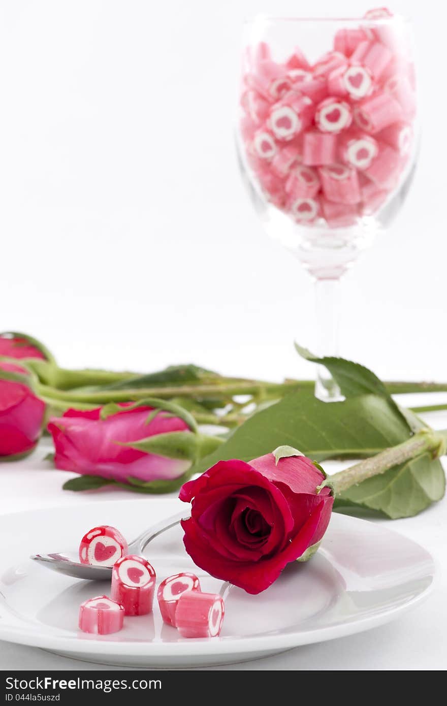 Valentine Series, Candy on dish with rose on white background