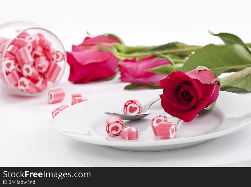 Valentine Series, Candy on dish with rose on white background