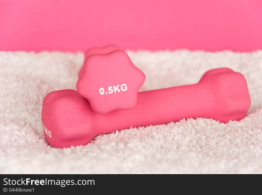 Pink Weights On White Towel