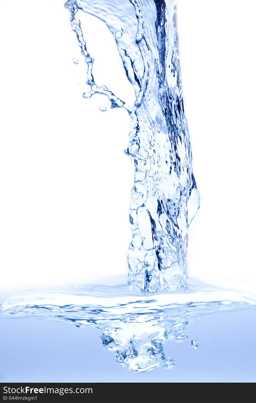 Water splashing from glass isolated on white