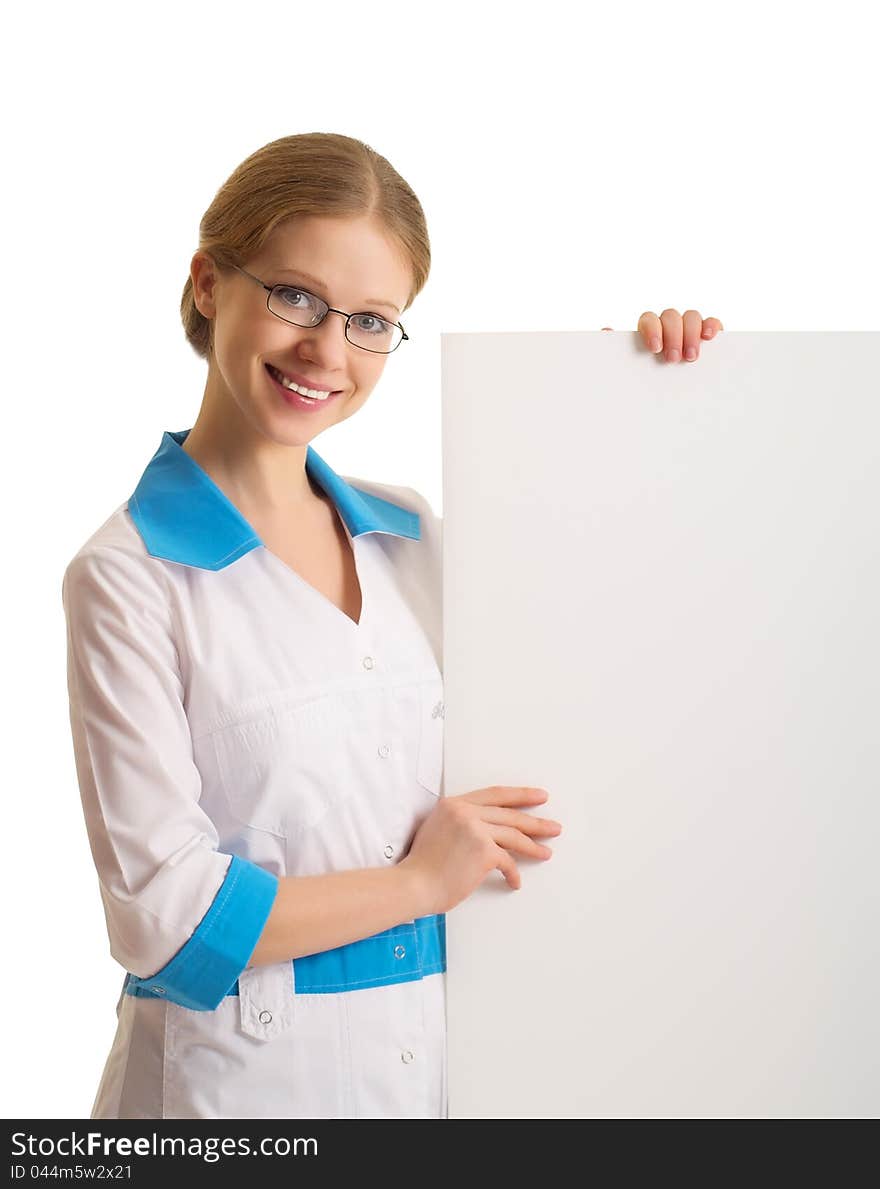Beautiful young female doctor holding a blank billboard isolated on white background