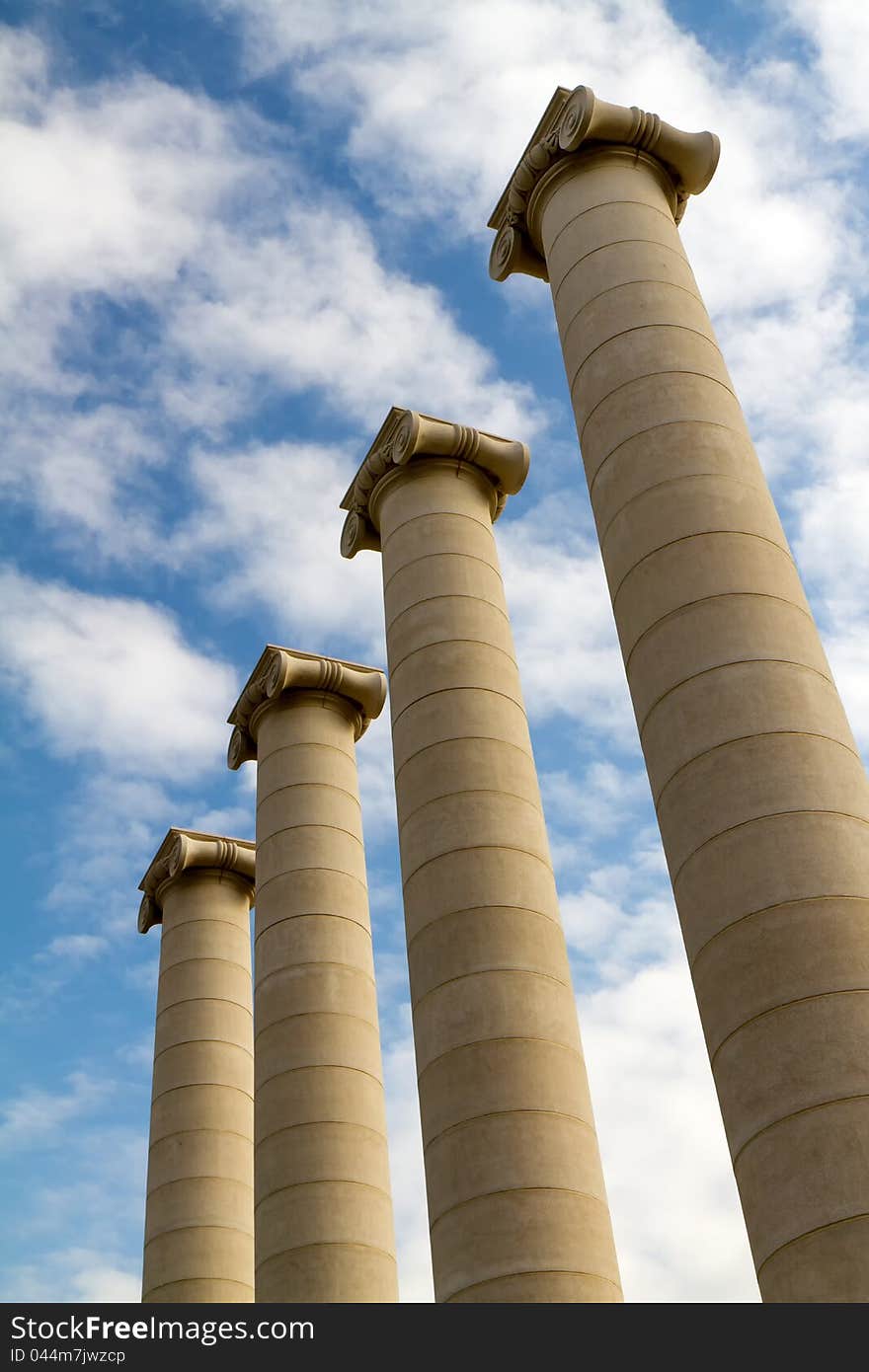 Four massive columns, blue sky