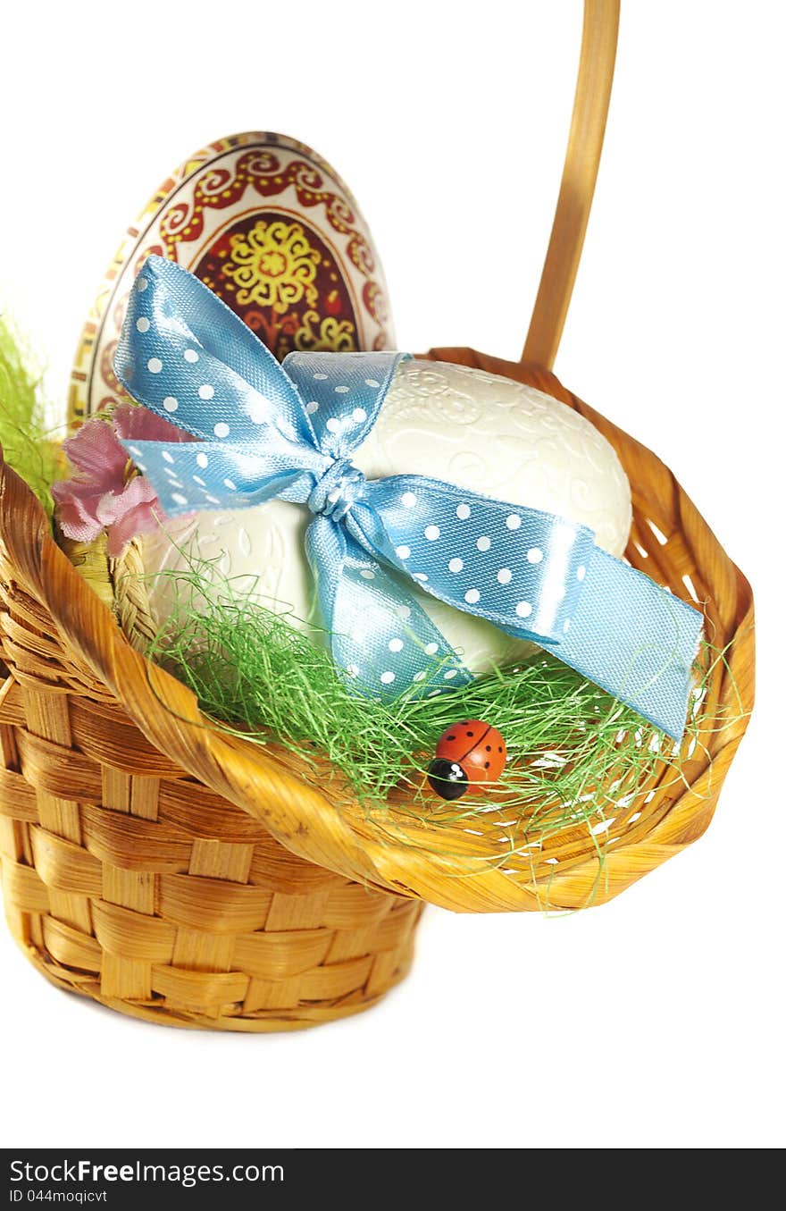 Easter Eggs   in the basket on a white basket