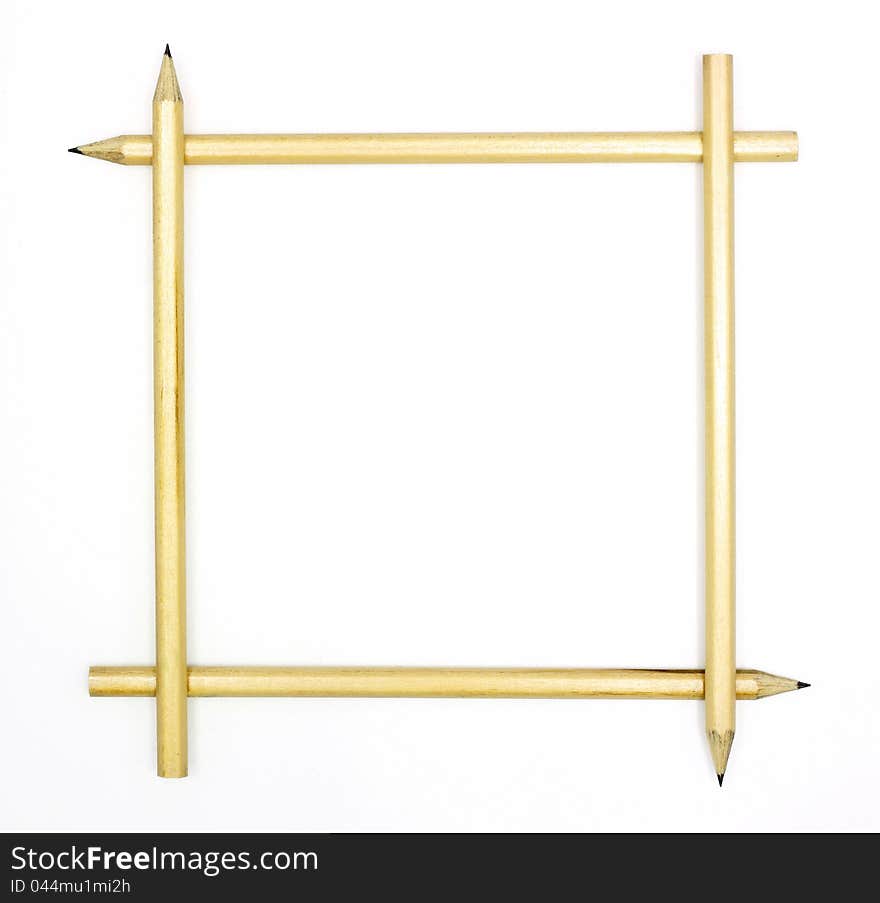 Four pencils arranged to form a square frame on white background.