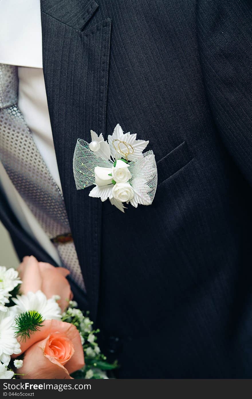 Posy with roses on groom suit. wedding decorate suit