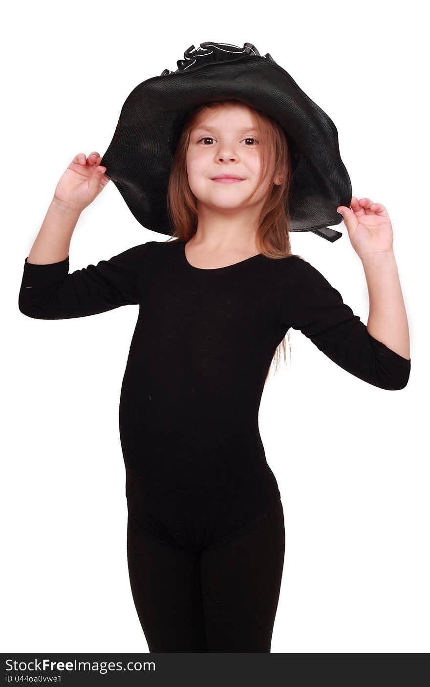 Cute little girl in a lovely black hat over white background. Cute little girl in a lovely black hat over white background