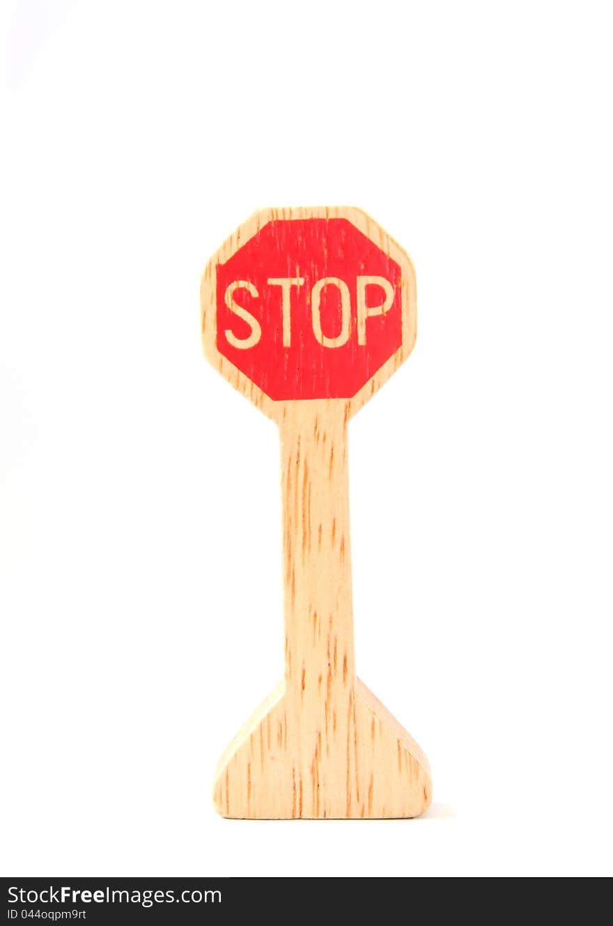 Wooden toy made like stop sign on white background