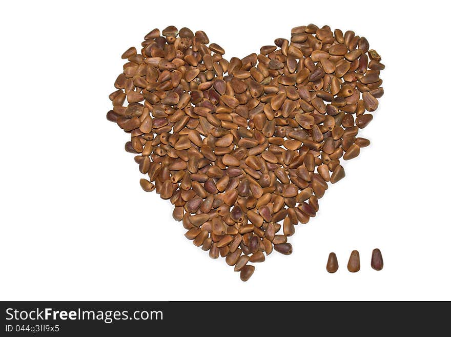A close-up shot of unshelled pine nuts(heart-shaped). A close-up shot of unshelled pine nuts(heart-shaped)