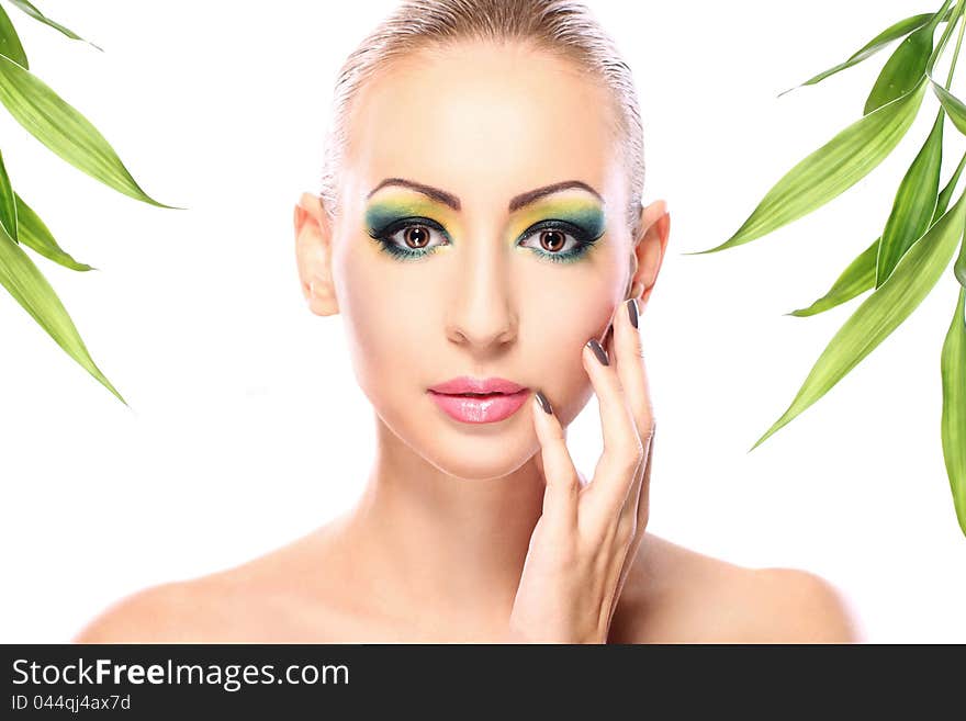 Beautiful blonde with artistic make- up and  bamboo leaves. Beautiful blonde with artistic make- up and  bamboo leaves