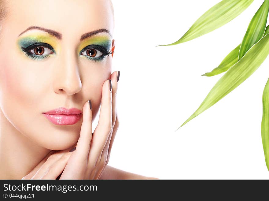 Beautiful blonde with artistic make- up and  bamboo leaves. Beautiful blonde with artistic make- up and  bamboo leaves