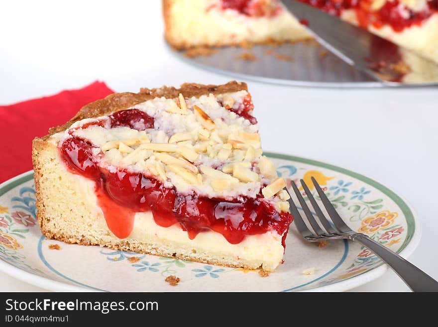 Slice of cherry cream cheese coffee cake on a plate. Slice of cherry cream cheese coffee cake on a plate