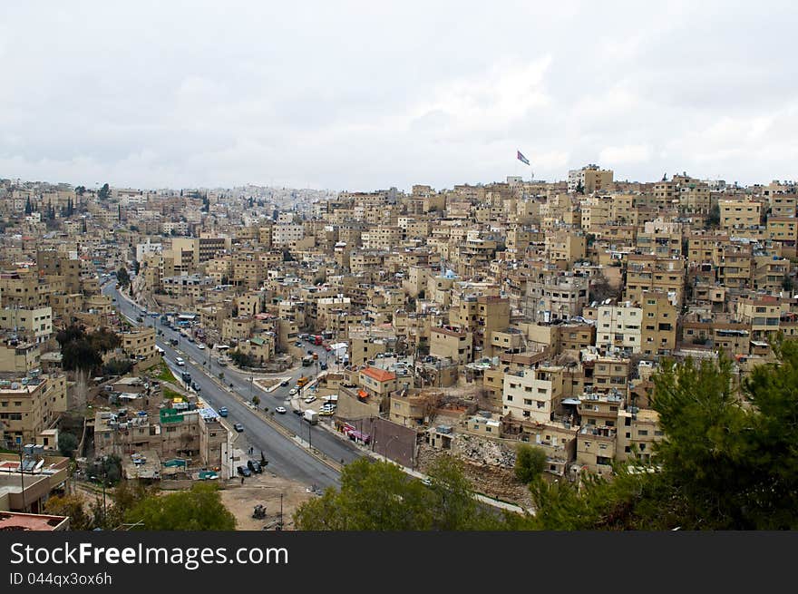 Cloudy day in Amman,Jordan with a flag ahead. Cloudy day in Amman,Jordan with a flag ahead