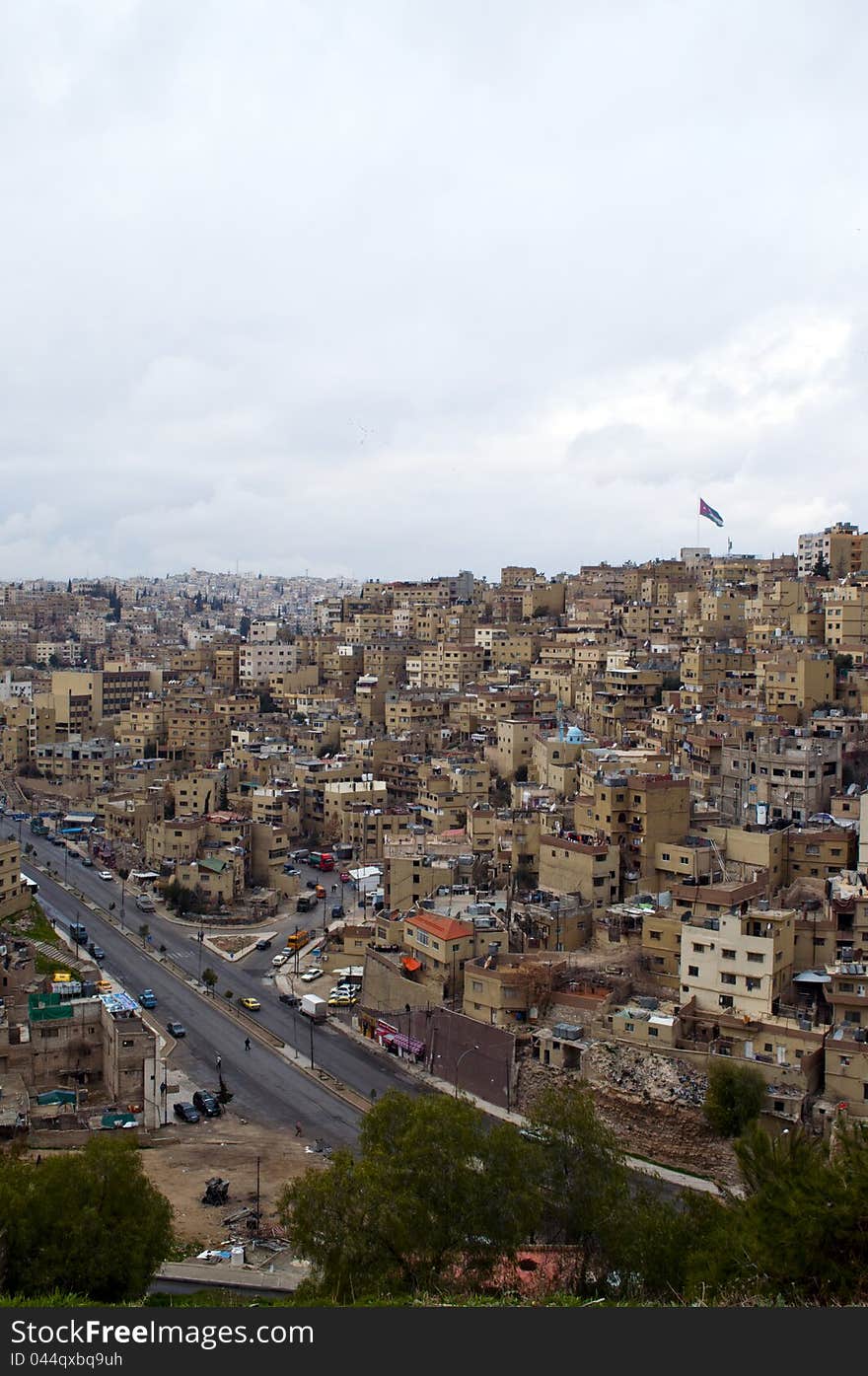 Cloudy day in Amman,Jordan with a flag ahead. Cloudy day in Amman,Jordan with a flag ahead