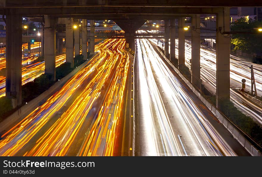 Lights on at night. In the city the car is running. Lights on at night. In the city the car is running.