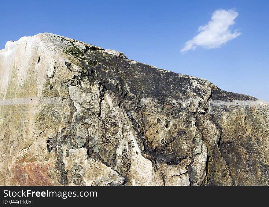 Igneous rock and blue sky in countryside scene. Igneous rock and blue sky in countryside scene