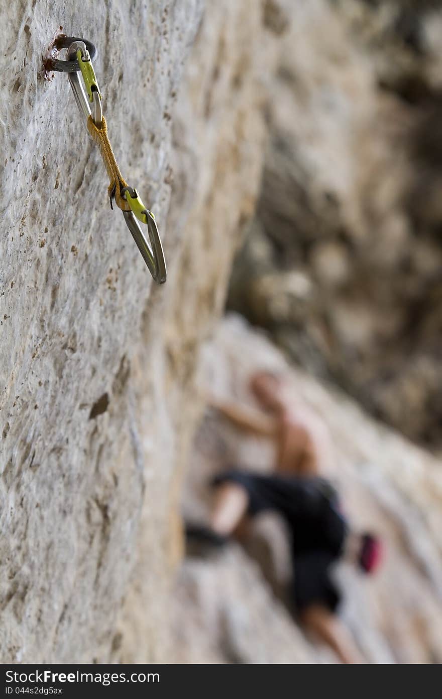 Climbing cam and climber in background