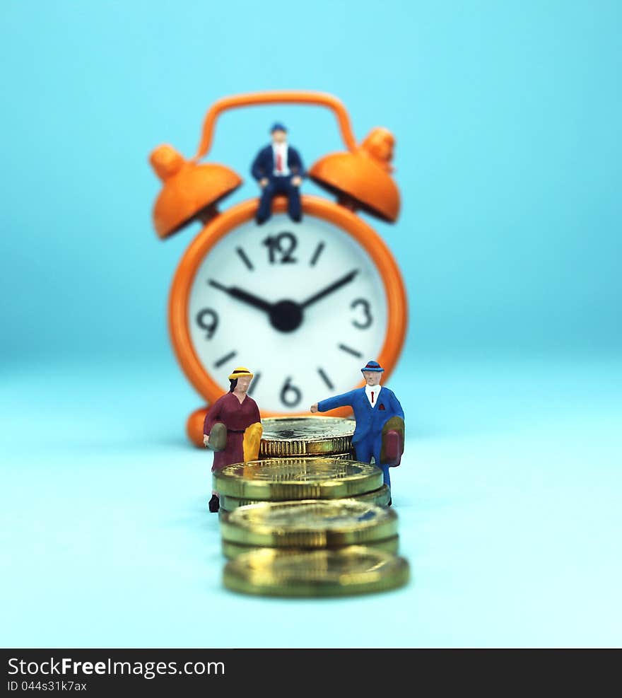 A couple walking away from a golden coin stairway, with the bank manager ahead of them sat on an orange alarm clock, asking the question, can you last the financial journey. A couple walking away from a golden coin stairway, with the bank manager ahead of them sat on an orange alarm clock, asking the question, can you last the financial journey.