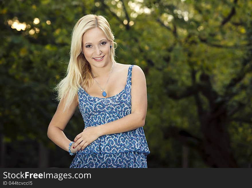 Outdoor portrait of a beautiful young girl smiling. Outdoor portrait of a beautiful young girl smiling