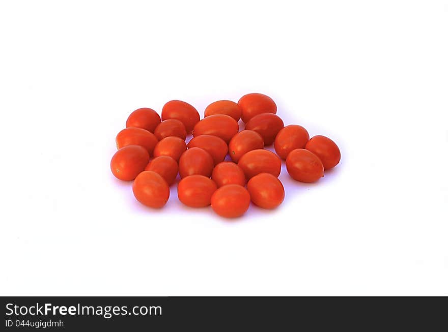 Red, small cherry tomat on white background