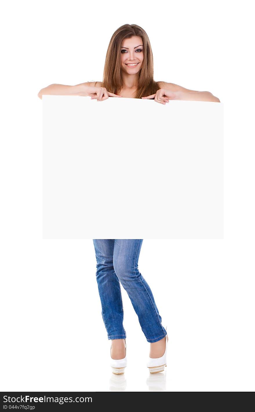 Portrait of a happy young woman holding a blank billboard