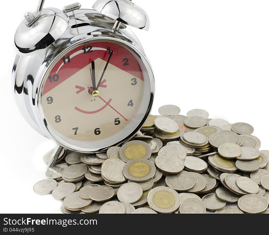 Alarm clock and Baht coins isolated on white background as banking concept. Alarm clock and Baht coins isolated on white background as banking concept.