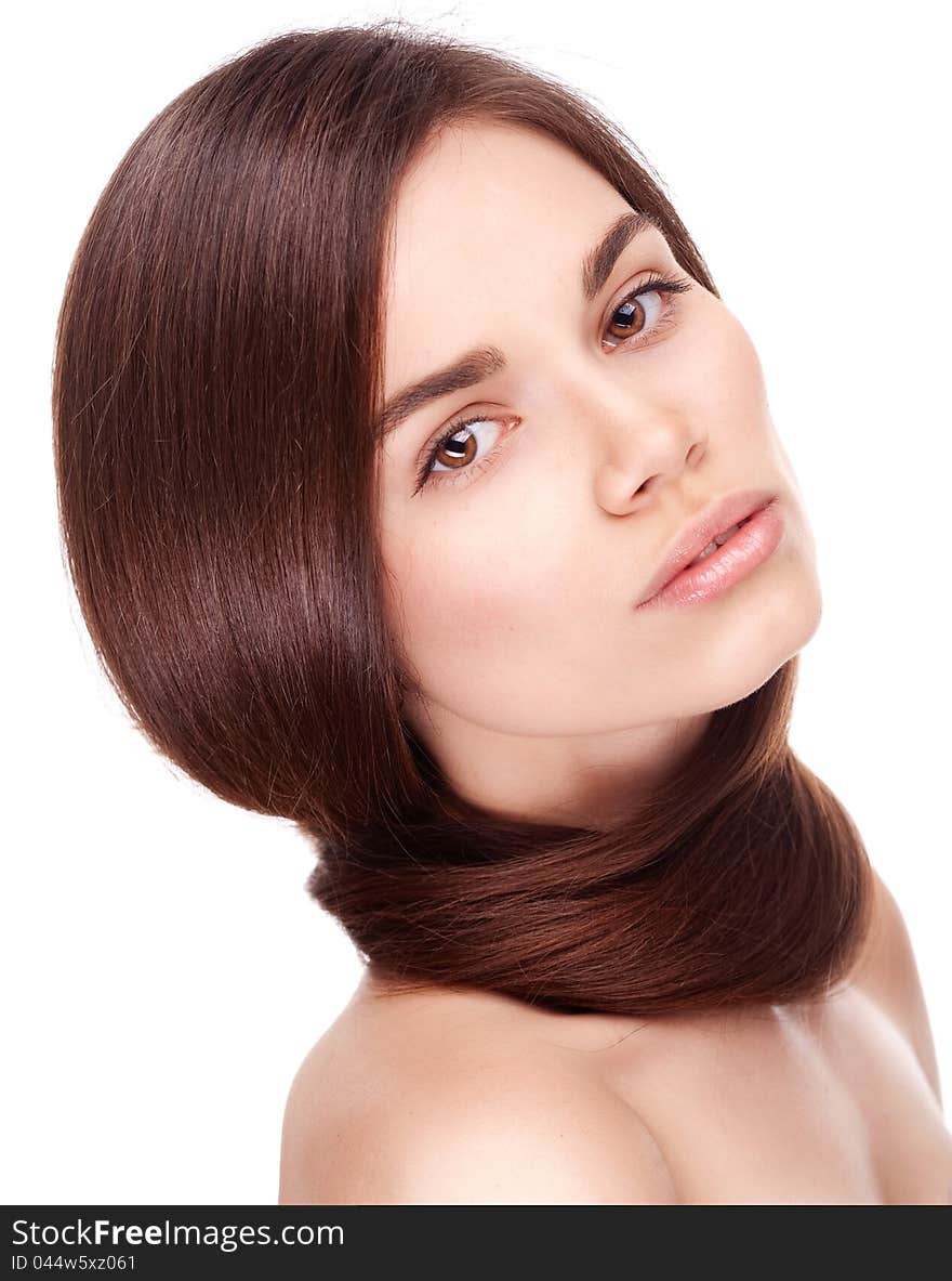 Studio portrait of attractive young woman with long hair on white background