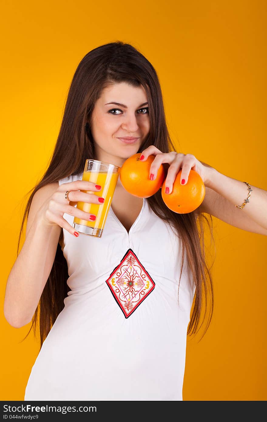 Pretty woman with juice an orange. Pretty woman with juice an orange