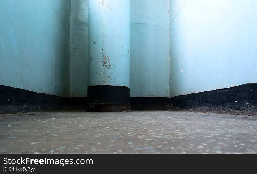 Old gloomy interior with dirty blue column. Old gloomy interior with dirty blue column