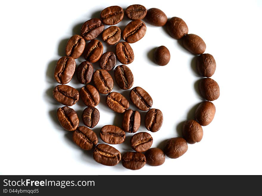 Yin-yang symbol made of coffee beans