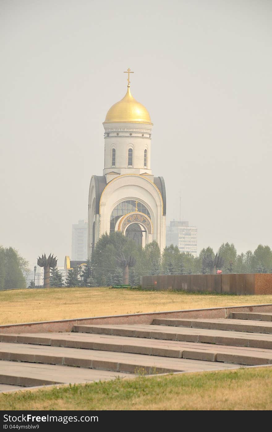 An orthodox church is in morning haze