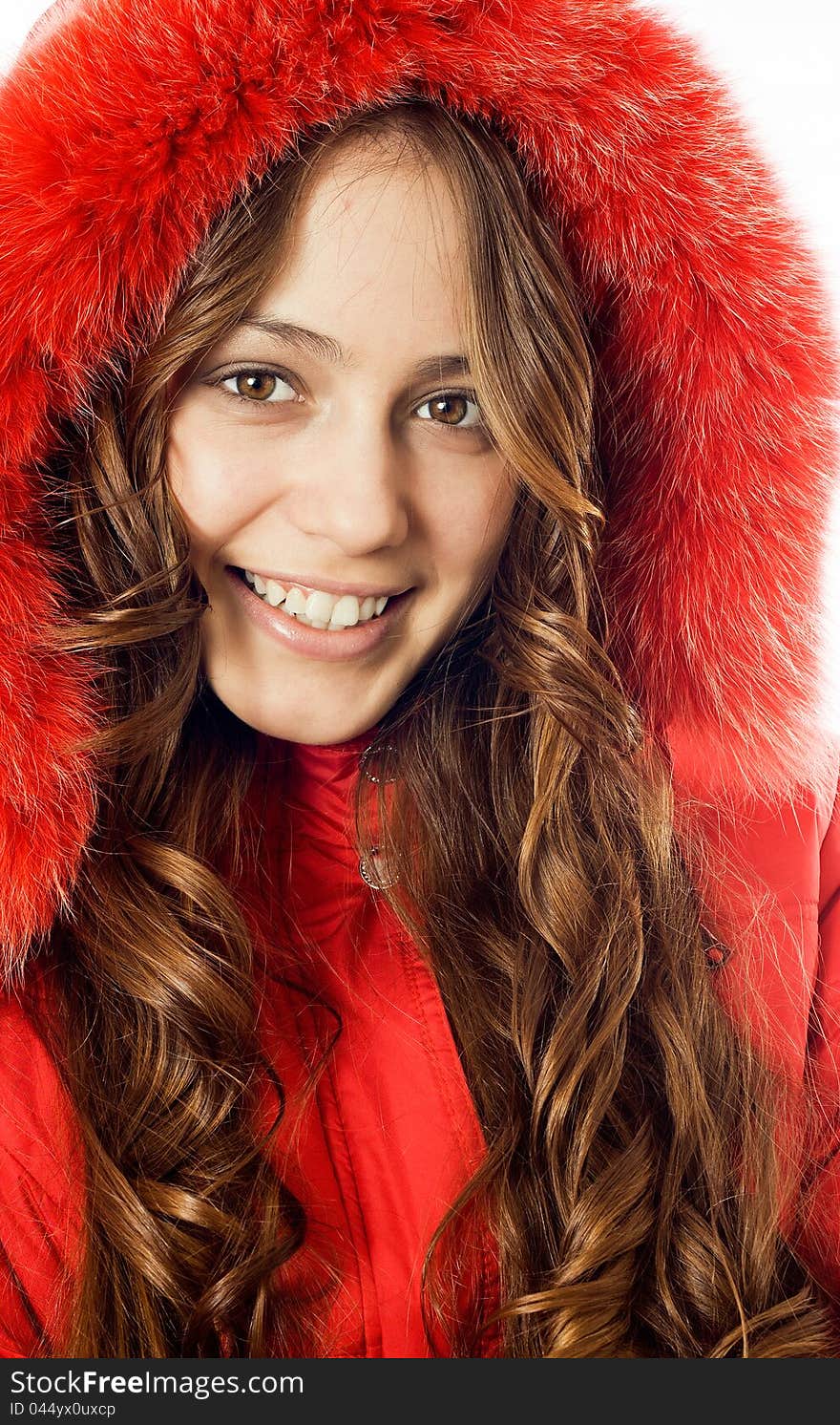 Portrait of a beautiful, smiling girl dress red fur coat. Portrait of a beautiful, smiling girl dress red fur coat