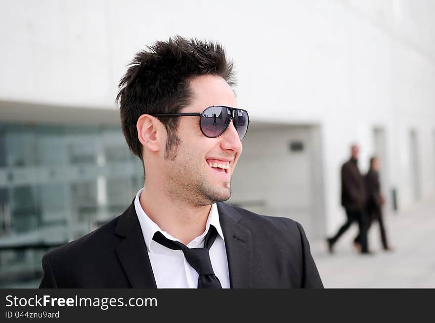 Attractive young businessman smiling