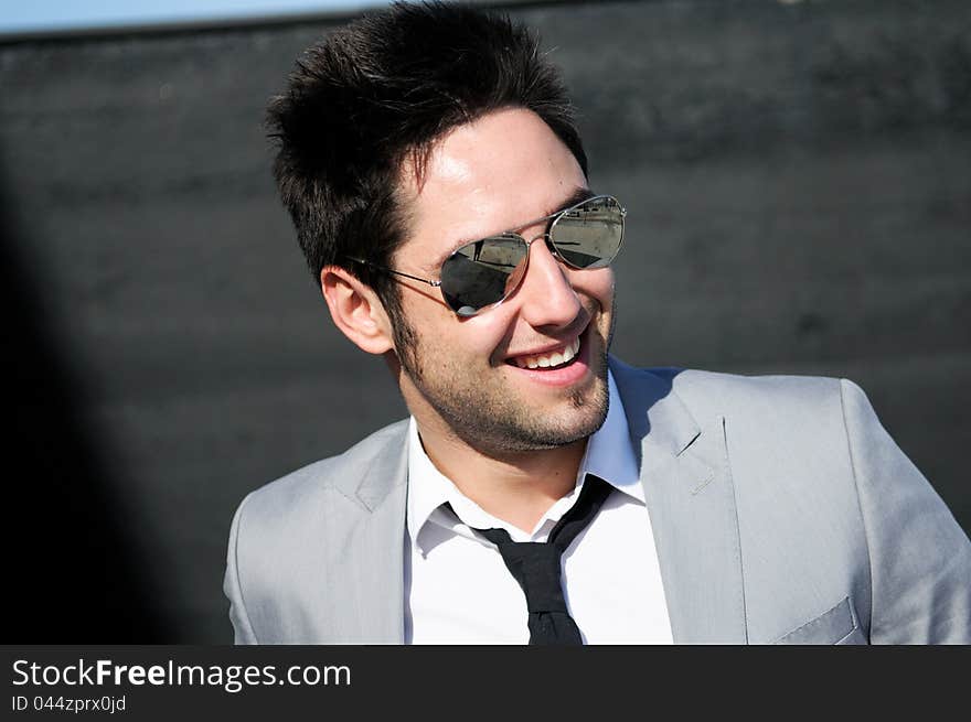 Portrait of a handsome young business man smiling. Portrait of a handsome young business man smiling