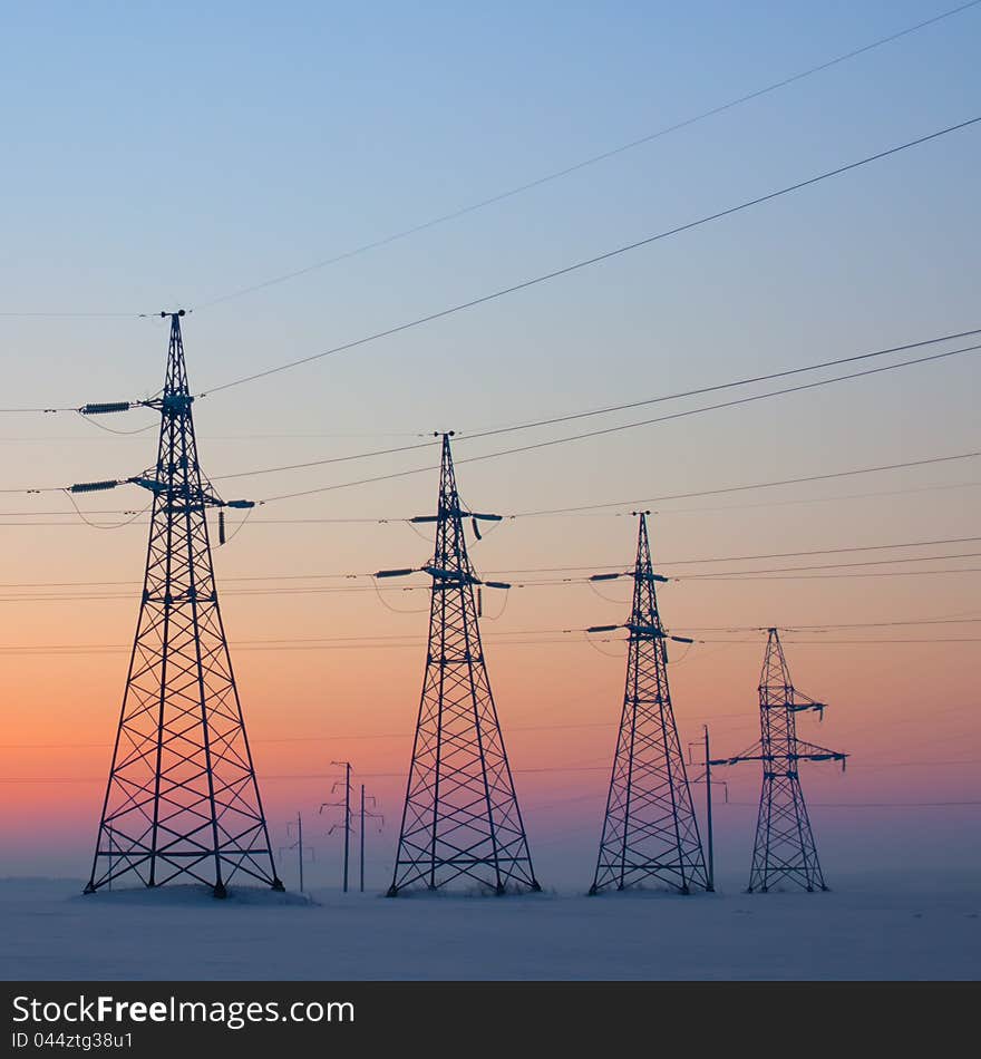 Electrical mast at morning snow