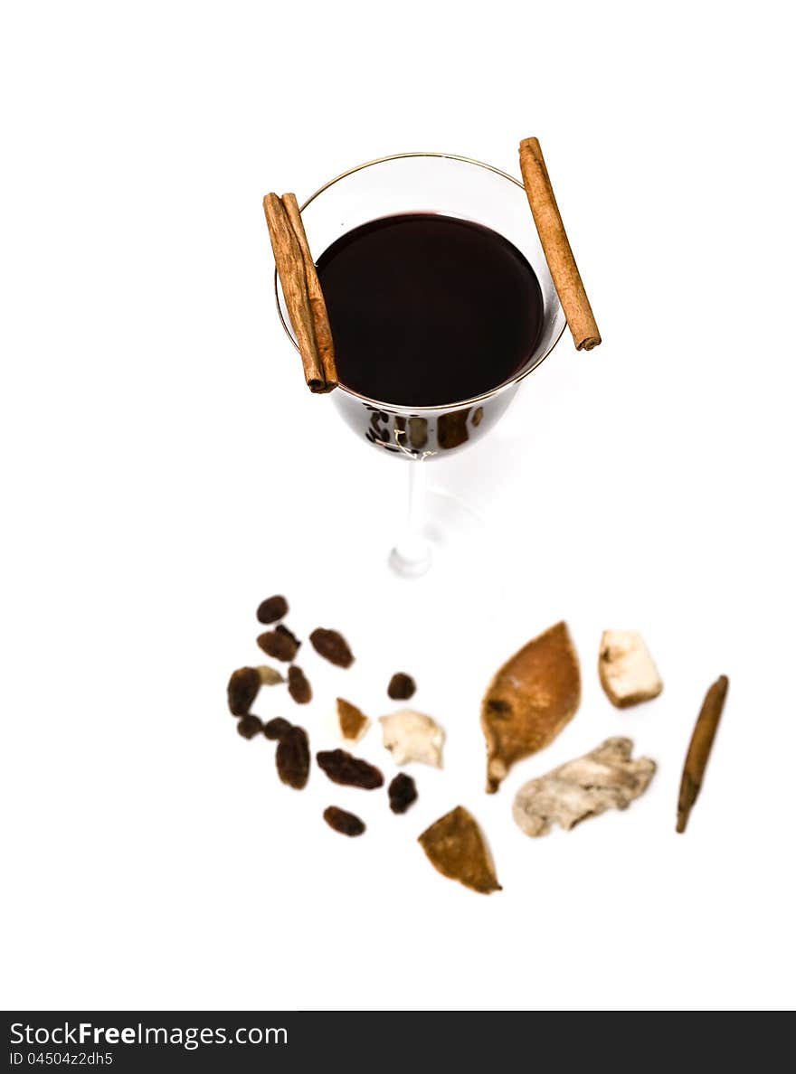 Mulled wine, cinnamon and spices isolated on white background