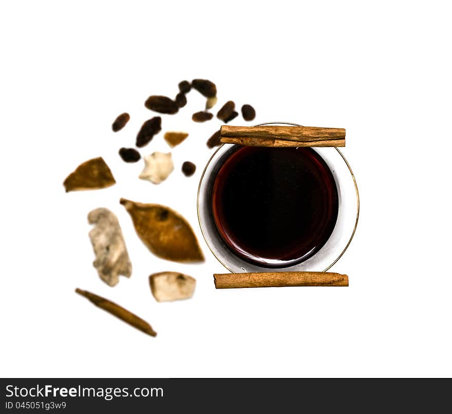 Mulled wine, cinnamon and spices isolated on white background