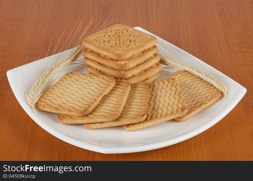 Cookies with spikelets on a white plate